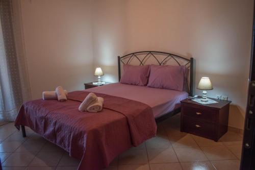 a bedroom with a bed with two towels on it at Nafpaktos comfort guest house in Nafpaktos