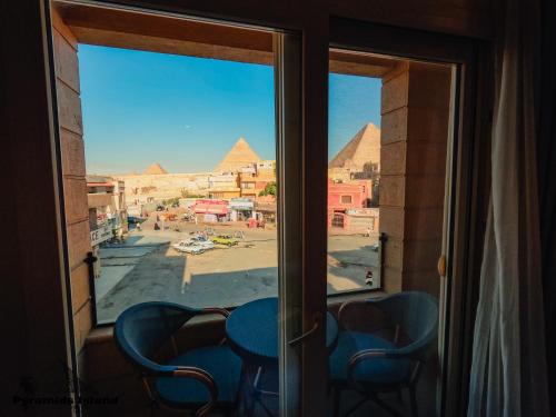 a view of the pyramids from the window of a room at Pyramids Island in Cairo