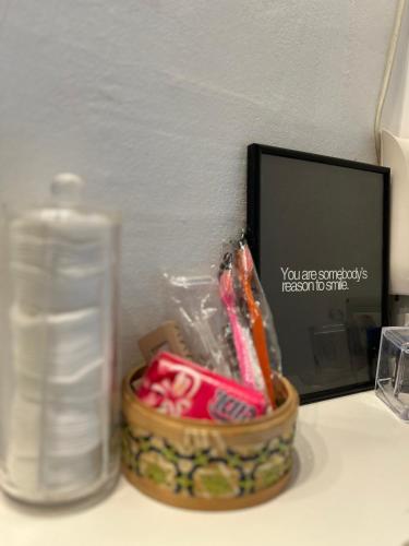 a bottle of water sitting next to a container of toothpaste at Cozy spot, Free Netflix and Prime in Vallensbæk