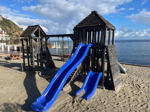 a playground on the beach with a slide at Ocean View Hamilton Cove Villa in Avalon