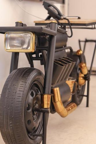 a close up of a motorcycle with a wheel at The White Knight Premium Boutique Hotel in Għajnsielem