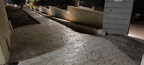 a cobblestone street at night with a building at AIR-IN Rooms with magnificent views in Spáta