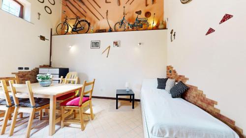 a room with a bed and a table and chairs at Casal Trinacria in Santa Teresa di Riva
