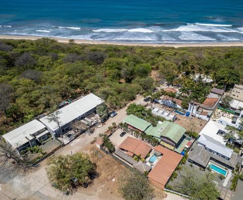 an overhead view of a small town next to the beach at BP Surf Hotel in Playa Grande