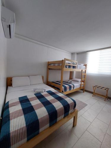 Postel nebo postele na pokoji v ubytování Libertad 109 Hotel