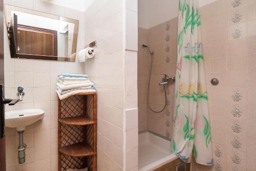 a bathroom with a shower and a sink at Apartments Marija in Rogoznica