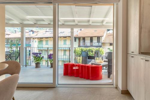 a kitchen with a sliding glass door to a patio at Luxury 2BR w/ River Castle View in Borgo Valsugana in Borgo