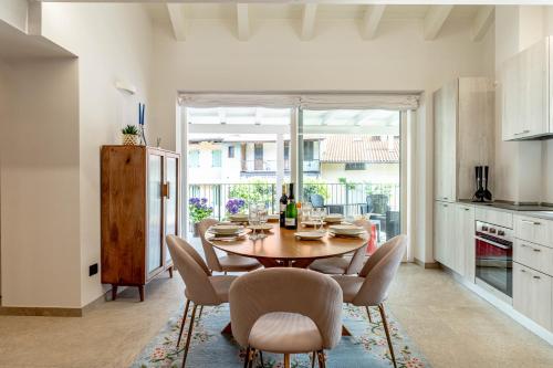 a kitchen and dining room with a table and chairs at Luxury 2BR w/ River Castle View in Borgo Valsugana in Borgo