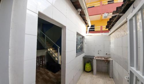 an empty room with a staircase in a building at Oceano Azul Hospedagens a 50 M DA ORLA-Passarela do Caranguejo in Aracaju