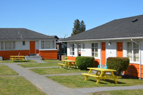 a row of houses with picnic tables in front of them at 2400 Motel in Vancouver