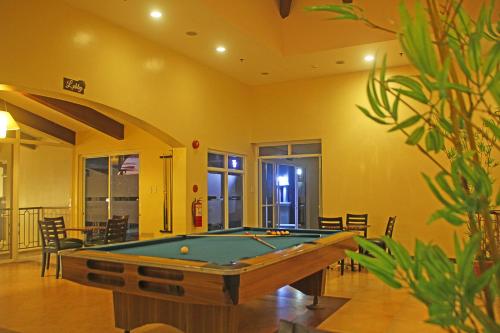 a billiard room with a pool table in it at Hotel Palacio Puerto Princesa in Puerto Princesa City