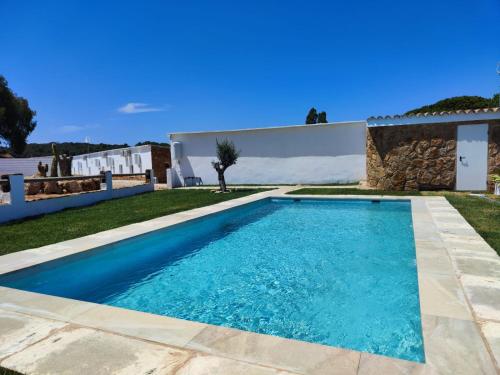 a swimming pool in the backyard of a villa at Hacienda la Yerbabuena in Cádiz