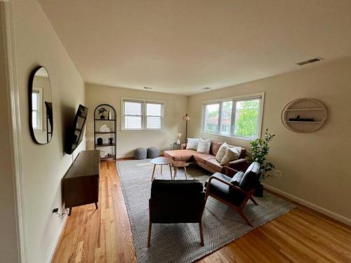 a living room with a couch and a table at New Cozy Penthouse in Arlington