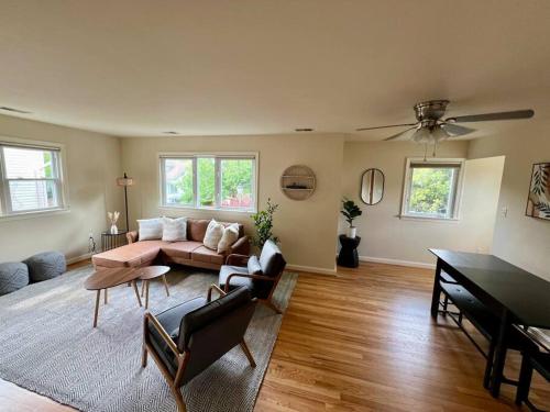 a living room with a couch and a table at New Cozy Penthouse in Arlington