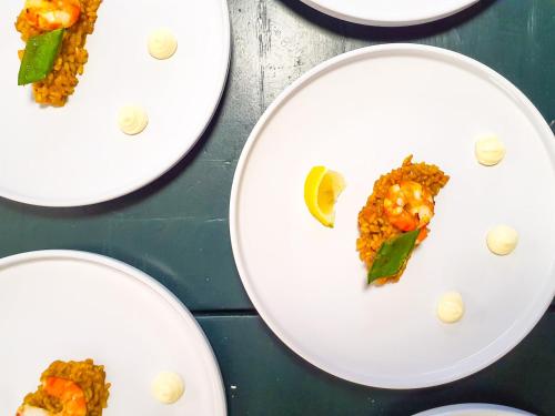three white plates of food on a table at Casa Gatti BnB Gastronomia e Benessere in Motto