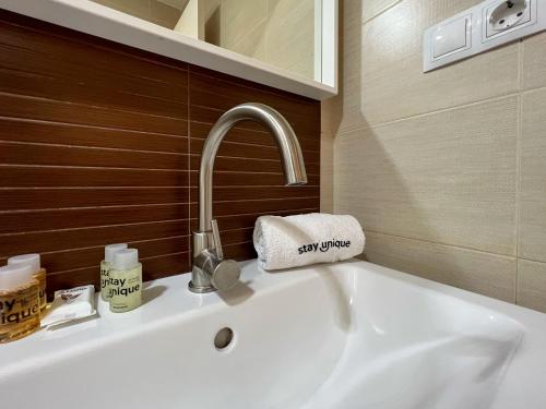 a sink in a bathroom with a faucet at Stay U-nique Apartments Rossello in Barcelona