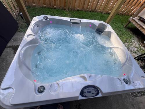 a white bath tub with water in it at The Eagles Nest in London