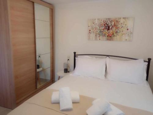 Postel nebo postele na pokoji v ubytování Galini Home
