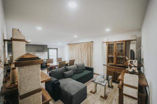 a living room with a couch and a table at Andar Moradia T2 na Casa Do Olival in São João da Pesqueira