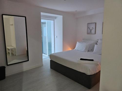 Ένα ή περισσότερα κρεβάτια σε δωμάτιο στο DoTejo Casa