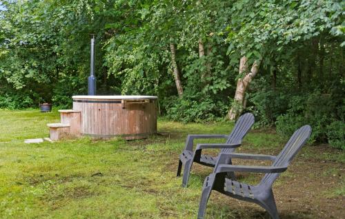 two chairs sitting in front of a hot tub at Nice Home In Hemmet With Kitchen in Hemmet