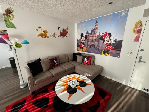 a living room with a couch and a table at Mario, Disney & not themed Loft Universal Studios 10min loft apartment in Los Angeles