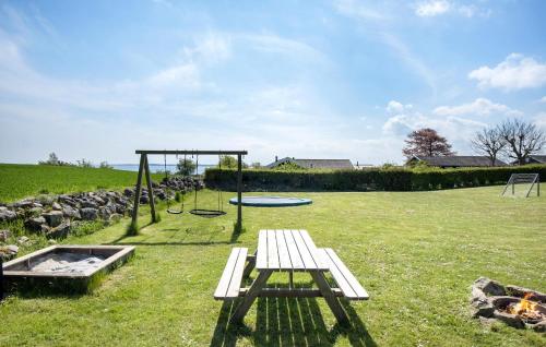 a park with a picnic table and a playground at 4 Bedroom Lovely Home In Faaborg in Fåborg
