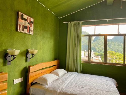 Cama o camas de una habitación en YangShuo Eden Inn