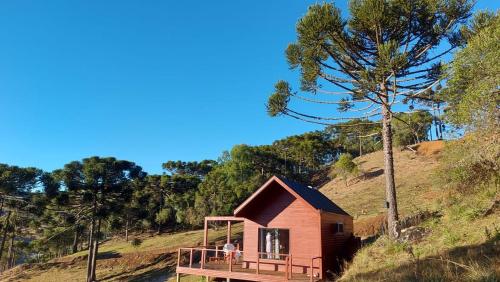 a small house on top of a hill at Monte Alegre Pousada in São Joaquim