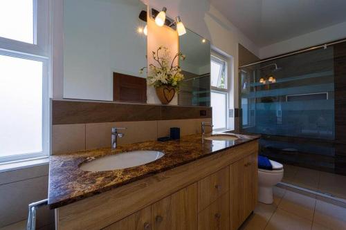 a bathroom with a sink and a toilet at Modern 3 Bedroom Pool Villa - MR54 in Hua Hin