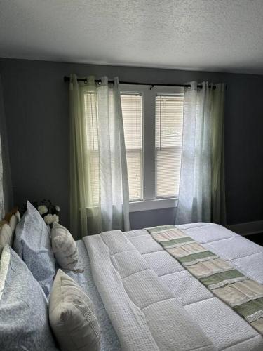 Ένα ή περισσότερα κρεβάτια σε δωμάτιο στο Cozy