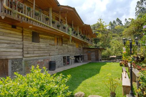an exterior view of a house with a yard at Cardisch in Santa Rosa de Cabal