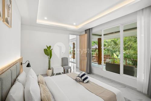 Postel nebo postele na pokoji v ubytování Kana Village Villa by Kozystay - Near Canggu