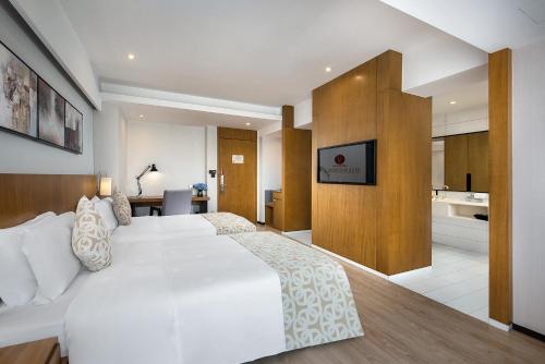 Postel nebo postele na pokoji v ubytování Hongdu Hotel