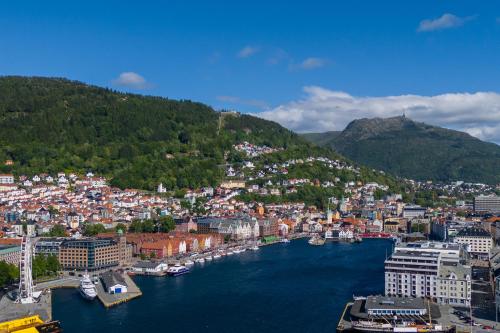 an aerial view of a city with a body of water at Bryggen // Fløyen Living in Bergen