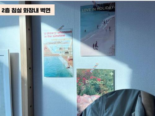 three pictures of a beach on a wall at Juns House 대인원 수용 가능, 2층 복층 주택, 테라스보유, 가족숙소 적합 in Pohang