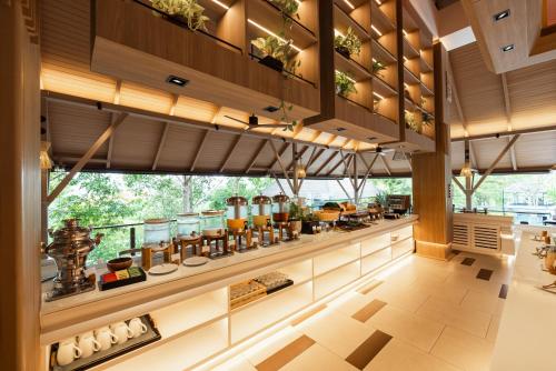 a kitchen with a counter with food on it at Villa Zolitude Resort & Spa - SHA Extra Plus in Chalong