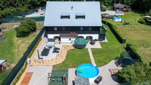 an aerial view of a house with a backyard at Chata Markétka in Dobré