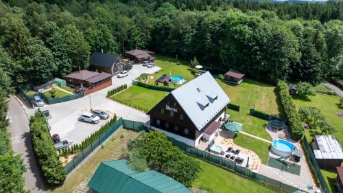 an aerial view of a large house with a yard at Chata Markétka in Dobré