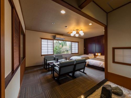 Una cama o camas en una habitación de Hirayukan