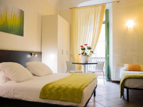 Posteľ alebo postele v izbe v ubytovaní Hotel Ligure