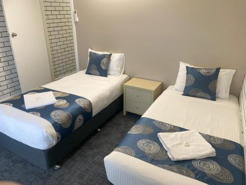 Postel nebo postele na pokoji v ubytování Tatura Country Motel