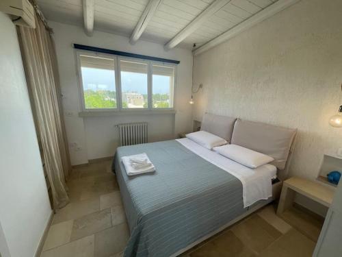 A bed or beds in a room at RIFUGIO Salentro