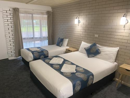 Postel nebo postele na pokoji v ubytování Tatura Country Motel