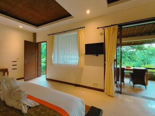 Кровать или кровати в номере The Iyang Ubud