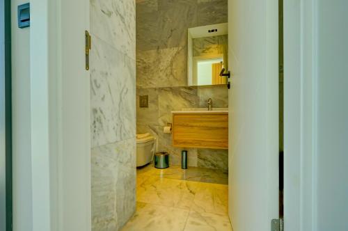 a bathroom with a sink and a mirror at Villa Pluto 1 - PLANET LUXURY VILLAS in İslâmlar
