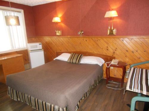 Katil atau katil-katil dalam bilik di Motel Le Paysan