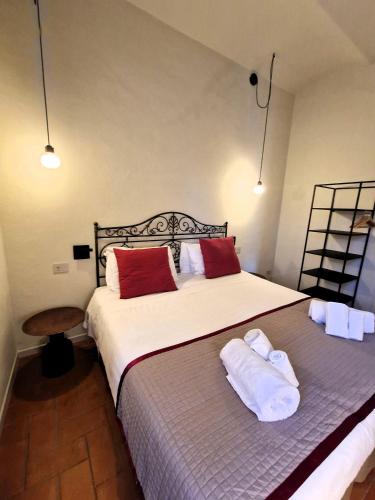 Ένα ή περισσότερα κρεβάτια σε δωμάτιο στο Borgo Dolciano