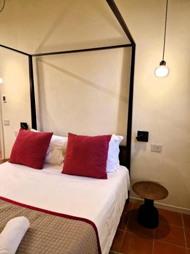 Ένα ή περισσότερα κρεβάτια σε δωμάτιο στο Borgo Dolciano