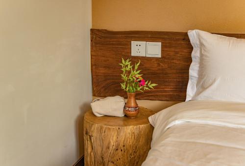 Postel nebo postele na pokoji v ubytování Nature Cure Village Lodge-婺源自在舍